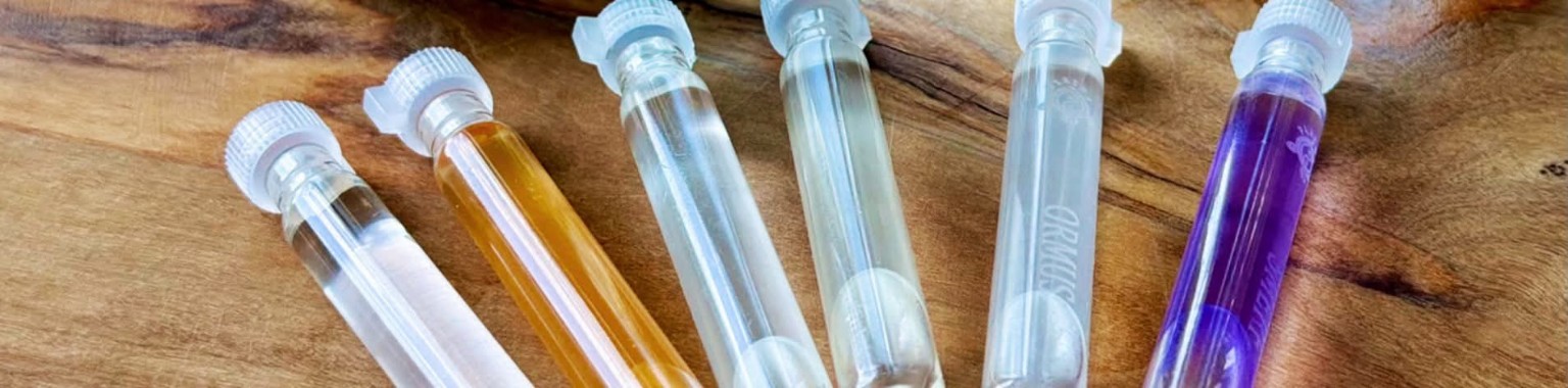 A selection of colourful GANS products in glass vials
